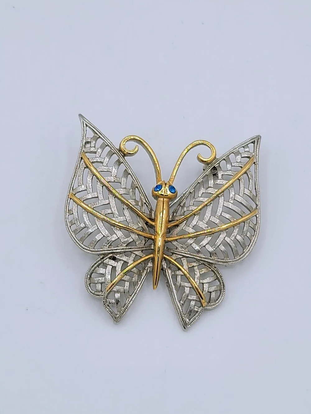 Avon Butterfly Brooch Two Tone Gold Silver Openwork Blue Rhinestone Eyes Vintage
